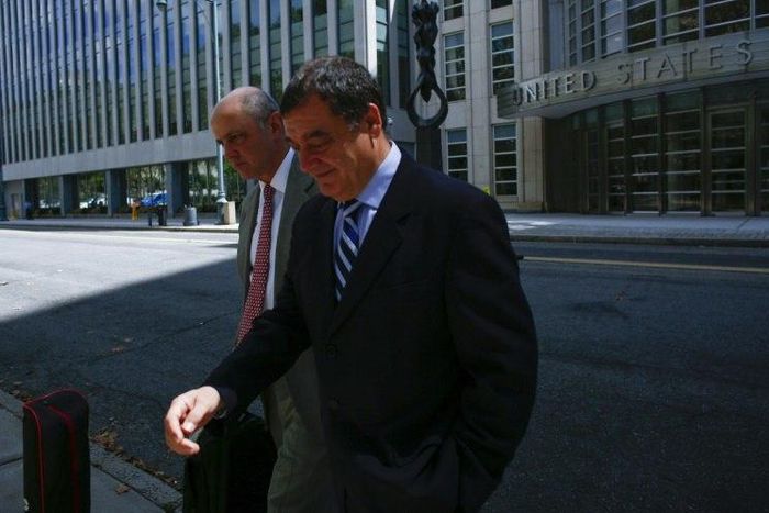 Costas Takkas (R), former secretary-general of the Cayman Islands Football Association seen leaving the Eastern District Court in Brooklyn, New York last year, pleaded guilty to Money laundering conspiracy in the sweeping FIFA corruption scandal