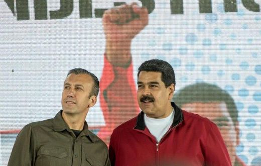 Venezuelan President Nicolas Maduro (right) and his Vice-President Tareck El Aissami participate in a Caracas rally on January 31, 2017