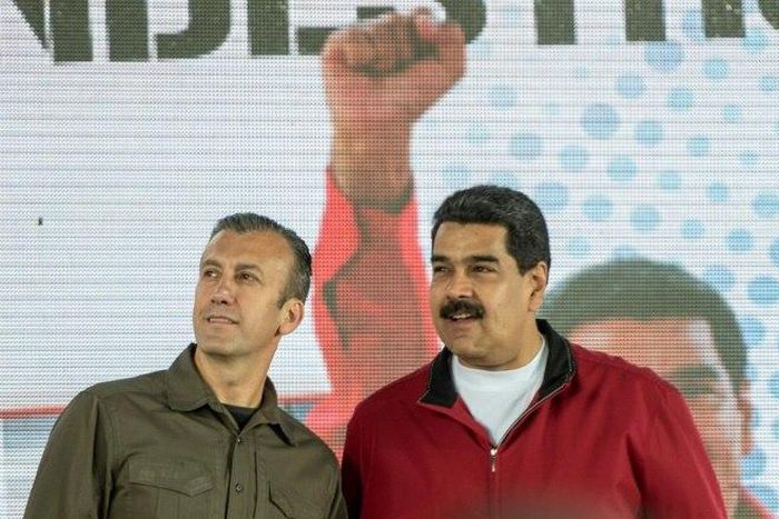 Venezuelan President Nicolas Maduro (right) and his Vice-President Tareck El Aissami participate in a Caracas rally on January 31, 2017