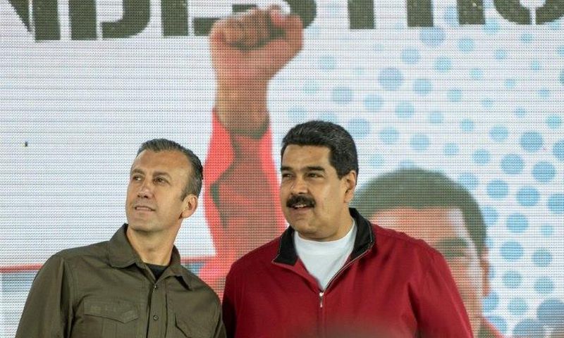 Venezuelan President Nicolas Maduro (right) and his Vice-President Tareck El Aissami participate in a Caracas rally on January 31, 2017