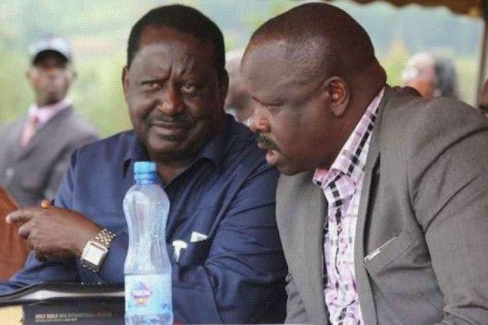 Raila Odinga (left) and Bomnet Governor Isaac Rutto.