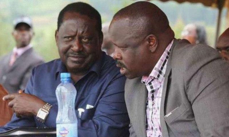 Raila Odinga (left) and Bomnet Governor Isaac Rutto.