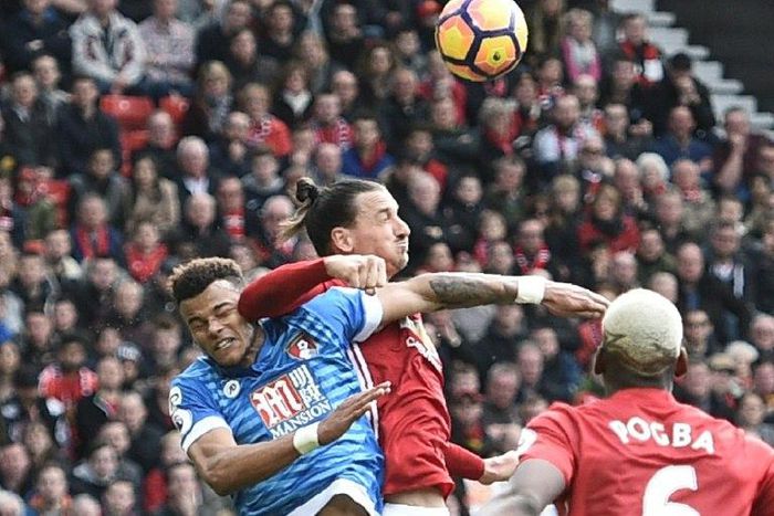 Manchester United's Zlatan Ibrahimovic (C) elbows Bournemouth's Tyrone Mings during the English Premier League football match at Old Trafford, north west England, on March 4, 2017