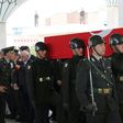 Turkish soldiers carry the coffin of Colonel Oguzhan Küçükdemirkol who was among 13 killed in the helicopter crash