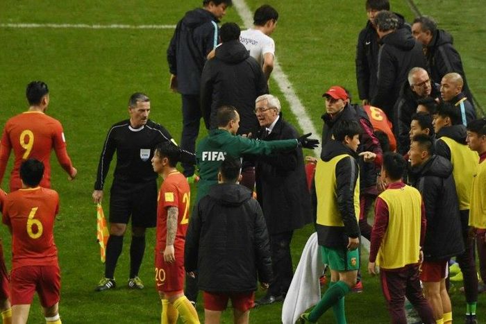 Marcello Lippi (C) says his China team must capitalise on their shock win over South Korea to build momentum in their World Cup qualifying campaign