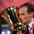 Juventus' coach from Italy Massimiliano Allegri kisses the trophy after winning the Italian Tim Cup final on May 17, 2017 at the Olympic stadium in Rome
