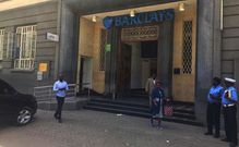 Police officers keep guard outside Barclays Bank of Kenya Queensway Branch in Nairobi in ongoing fake cash investigation
