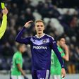 Anderlecht's forward Lukasz Teodorczyk (R) reacts after receiving a yellow card during the UEFA Europa League football match against Saint-Etienne December 8, 2016