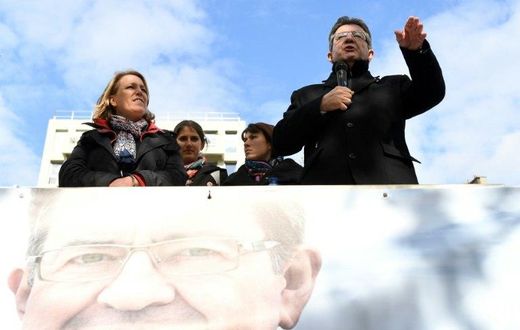 French presidential election candidate for the far-left coalition La France insoumise Jean-Luc Melenchon, speaks next to Left Party's coordinator Dannielle Simonnet aboard an "unbowed" barge on the Canal Saint-Martin on April 17, 2017 in Paris