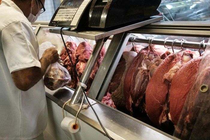 An employee sells meat during an inspection by Rio de Janeiro state's consumer protection agency, PROCON, at a supermarket in Rio de Janeiro, Brazil, on March 24, 2017