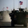 Convoy of US armoured vehicles drives near the village of Yalanli, on the western outskirts of the northern Syrian city of Manbij