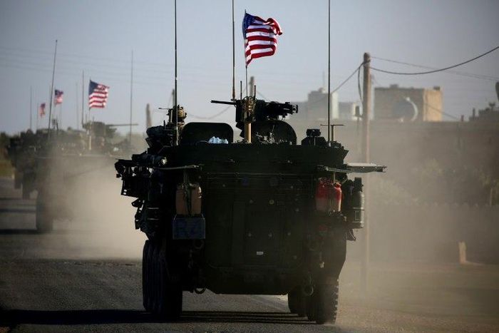 Convoy of US armoured vehicles drives near the village of Yalanli, on the western outskirts of the northern Syrian city of Manbij