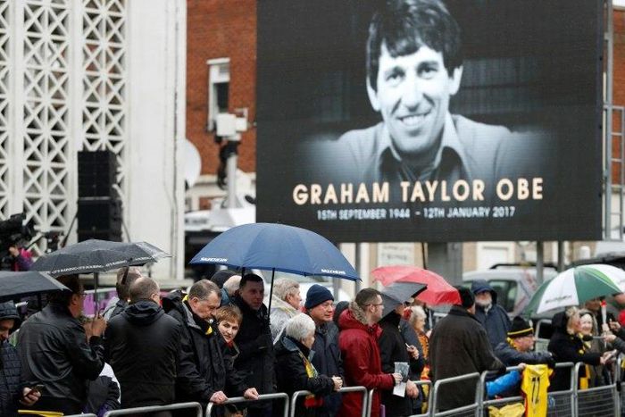 Wellwishers wait outside the church before the funeral service of former England and Watford manager Graham Taylor in Watford on February 1, 2017