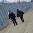 Soldiers patrol along the border fence on the Hungarian-Serbian border in February 2017