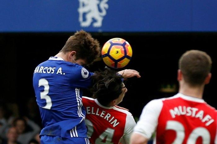 Chelsea's Marcos Alonso rises above Arsenal's Hector Bellerin to score the opening goal during their English Premier League match at Stamford Bridge in London, on February 4, 2017