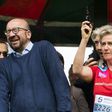 Prime Minister Charles Michel reacts as Princess Astrid of Belgium fires the starting pistol for a running race in Brussels on May 28