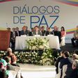 Colombian government representative Juan Camilo Restrepo (C-L), Ecuadorean Foreign Minister Guillaume Long (C) and Colombia's ELN guerrilla member Pablo Beltran (C-R) attend peace talks in Sangolqui, Ecuador on February 7, 2017