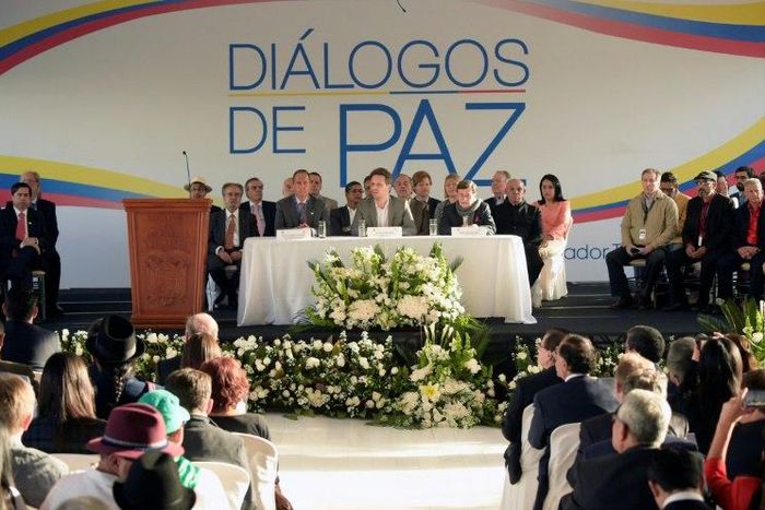 Colombian government representative Juan Camilo Restrepo (C-L), Ecuadorean Foreign Minister Guillaume Long (C) and Colombia's ELN guerrilla member Pablo Beltran (C-R) attend peace talks in Sangolqui, Ecuador on February 7, 2017