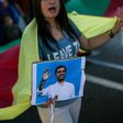 A Kurdish woman holds a photo of arrested HDP co-leader Selahattin Demirtas at a protest in Athens, Greece