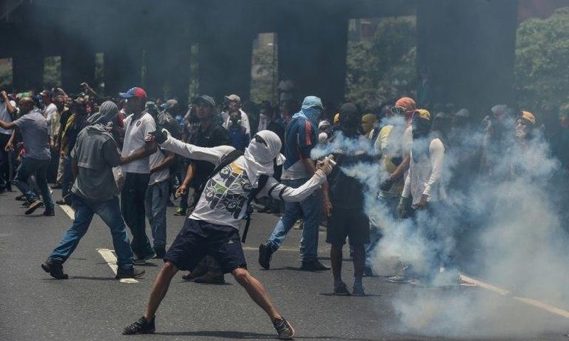 Marchers in Caracas were forced back by lines of soldiers and police deployed to contain what the opposition vowed would be the "mother of all protests"