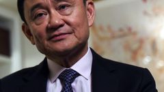 Deposed former Thai Prime Minister Thaksin Shinawatra answers a question during an interview in New York, on March 9, 2016