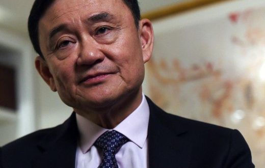 Deposed former Thai Prime Minister Thaksin Shinawatra answers a question during an interview in New York, on March 9, 2016