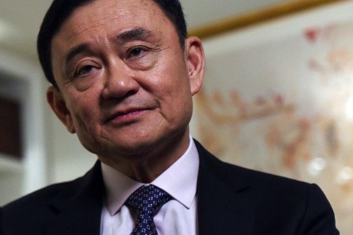 Deposed former Thai Prime Minister Thaksin Shinawatra answers a question during an interview in New York, on March 9, 2016