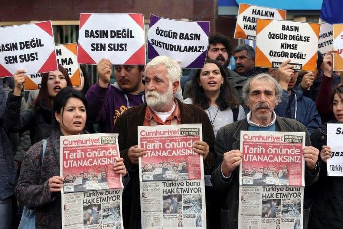 Protesters hold copies of Turkish daily newspaper "Cumhuriyet" during a demonstration outside the newspaper's headquarters in Ankara in November 2016, following the arrest of nine Cumhuriyet staff