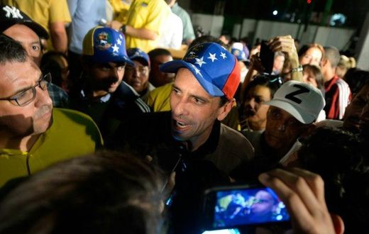Venezuelan opposition leader Henrique Capriles (C) told the media in Caracas "If the dictatorship is squealing, it is a sign that we are making progress"