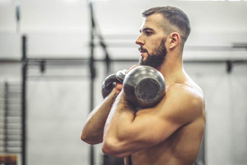 Strong man is doing  cross training exercise