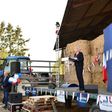 French presidential election candidate for the far-right Front National (FN) party Marine Le Pen (R) delivers a speech during a campaing rally at the Puybonnieux farm in Pageas, near Limoges, on April 13, 2017