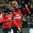 Guingamp's forward Yannis Salibur (C) is congratulated by forward Jimmy Briand (R) after scoring during the French Ligue 1 football match against Nantes on December 3, 2016