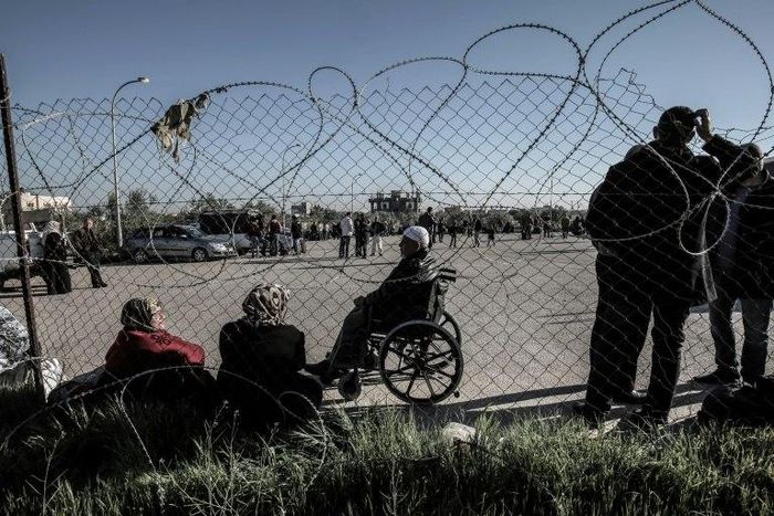 Palestinians wait for travel permits to cross into Egypt through the Rafah border crossing in March 2017