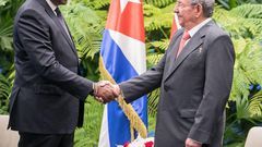 President Uhuru Kenyatta shakes hands with Cuban President Raul Castro in Cuba on March 15, 2019
