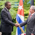 President Uhuru Kenyatta shakes hands with Cuban President Raul Castro in Cuba on March 15, 2019