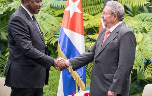 President Uhuru Kenyatta shakes hands with Cuban President Raul Castro in Cuba on March 15, 2019