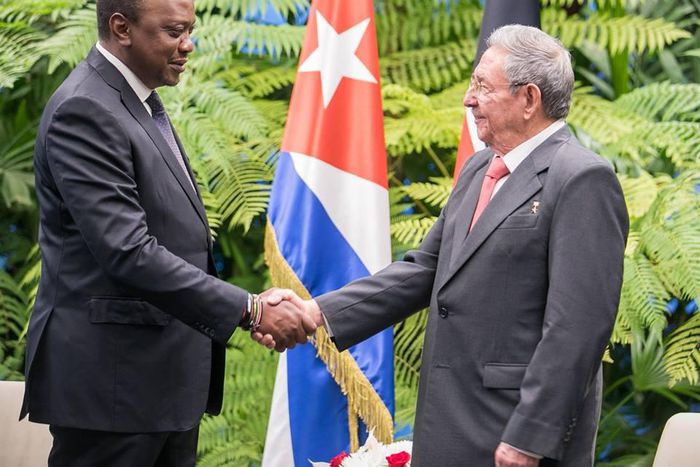 President Uhuru Kenyatta shakes hands with Cuban President Raul Castro in Cuba on March 15, 2019