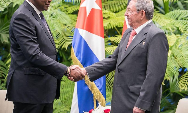 President Uhuru Kenyatta shakes hands with Cuban President Raul Castro in Cuba on March 15, 2019