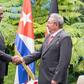 President Uhuru Kenyatta shakes hands with Cuban President Raul Castro in Cuba on March 15, 2019