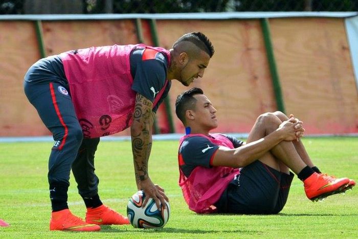 Chile forwards Arturo Vidal (left) and Alexis Sanchez stretch during a 2014 training session in Belo Horizonte
