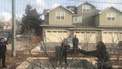 White officer placed on leave after detaining black man picking up trash in front of his building