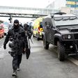 Police officers secure the area at Paris' Orly airport on March 18, 2017, after a man was shot dead when he tried to grab an officer's weapon