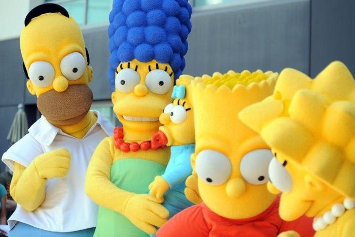 "The Simpsons", consisting of Homer (2nd L), Marge, Maggie (C), Bart and Lisa (2nd R), will return for its 29th and 30th seasons, breaking the record for most episodes previously held by Western drama "Gunsmoke"