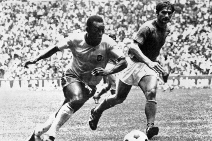 Brazilian midfielder Pele (L), today considered the greatest footballer ever by many, dribbles past Italian defender Tarcisio Burgnich during the 1970 World Cup final in Mexico City