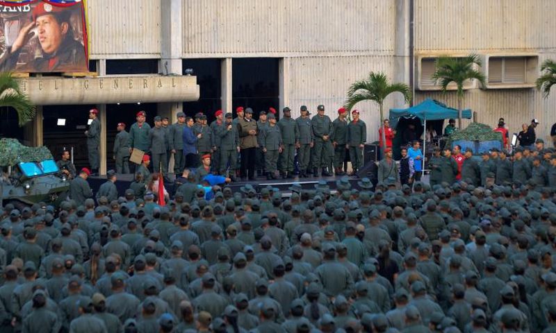 This handout picture released by the presidency shows Venezuela's Nicolas Maduro addressing troops after a failed military uprising