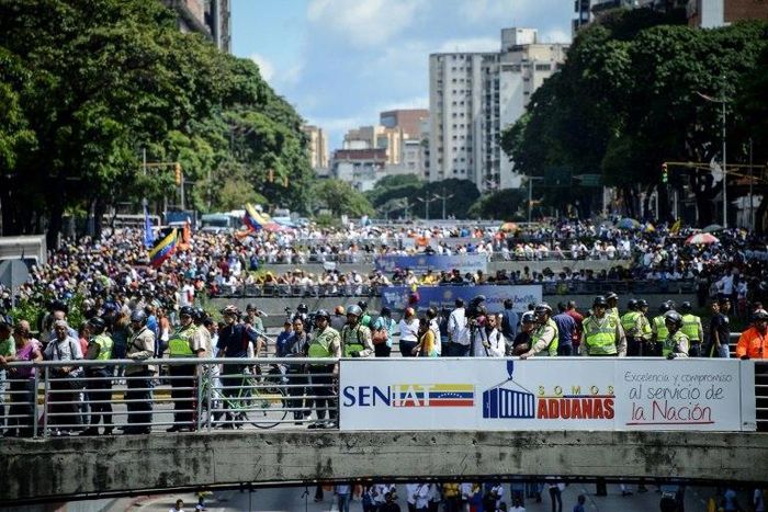 Opponents of Venezuelan President Nicolas Maduro hold a demostration in Caracas on January 23, 2017