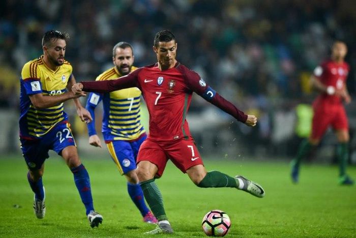 Portugal's forward Cristiano Ronaldo (R) vies with Andorra's midfielder Victor Rodriguez (L) during the World Cup 2018 qualification match