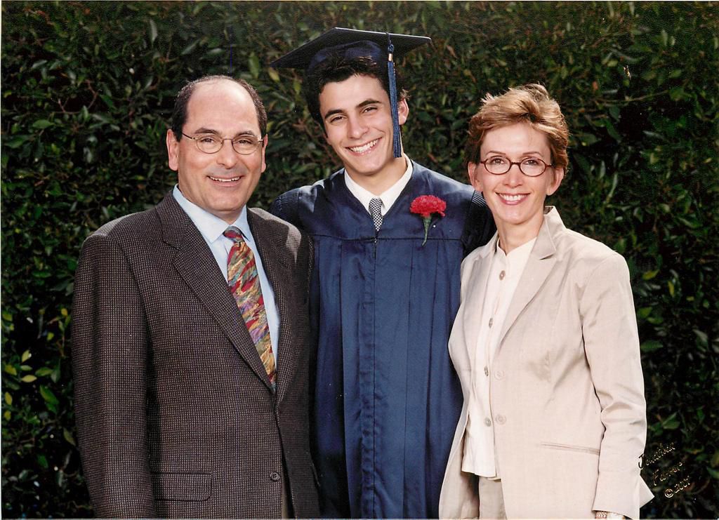 Jason, age 18, with parents Chuck and Kathleen at high school graduation.