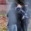 Policemen bring a man to the Federal German Prosecutor on November 8, 2016 in Karlsruhe, suspected of links to the Islamic State organisation
