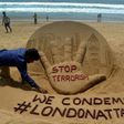 Indian sand artist Sudarsan Pattnaik creates a sculpture on Puri Beach on the Bay of Bengal the day after the London attack